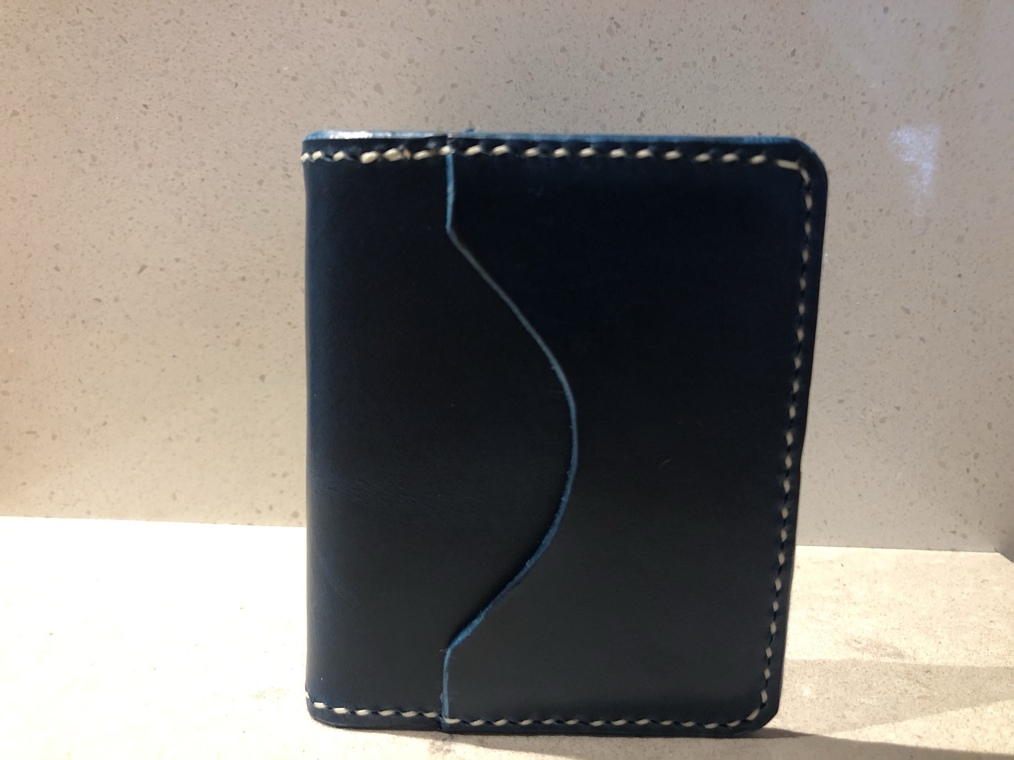 Blue Buttero Wallet in a standing position
